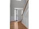 Bright foyer with hardwood floors, staircase, and paneled walls at 7290 Weber St, Atlanta, GA 30349