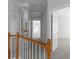View of hallway and staircase with neutral walls, carpet and doors at 7290 Weber St, Atlanta, GA 30349