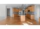 Kitchen with a large center island, light wood cabinets, and granite countertops at 7290 Weber St, Atlanta, GA 30349