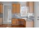 Kitchen nook area with granite countertops, tiled backsplash, desk, and bright natural light at 7290 Weber St, Atlanta, GA 30349