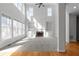 Bright living room with large windows, built-in shelves, and a cozy fireplace at 7290 Weber St, Atlanta, GA 30349