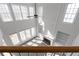 A high angle shows the natural light and the built in shelving of the living room at 7290 Weber St, Atlanta, GA 30349