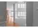 Bright living space with high ceilings, multiple windows, and an open floor plan, seamlessly connecting living areas at 7290 Weber St, Atlanta, GA 30349