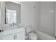 Clean, all-white bathroom with subway tile surround and modern fixtures at 1115 Larkin Dr, Buford, GA 30518