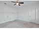 Bedroom with carpet, ceiling fan, and three doors at 1115 Larkin Dr, Buford, GA 30518