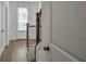 Bright entryway with hardwood floors, stairway and natural light at 1115 Larkin Dr, Buford, GA 30518