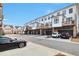 Townhome exterior showcases individual garages and private balconies, blending comfort and style at 1115 Larkin Dr, Buford, GA 30518