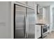 Stainless steel refrigerator and oven in modern kitchen with white cabinetry at 1115 Larkin Dr, Buford, GA 30518
