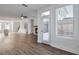 Open concept features fireplace, hardwood floors, and large windows for plenty of natural light at 1115 Larkin Dr, Buford, GA 30518