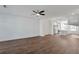 Spacious open floorplan with wood floors connecting the living room and kitchen at 1115 Larkin Dr, Buford, GA 30518