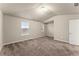 Spacious bedroom with carpeting and natural light from two windows at 116 Cabin Way, Hampton, GA 30228