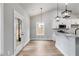 Dining Area with modern light fixtures, luxury vinyl flooring, and access to backyard at 286 Old Yorkville Rd, Dallas, GA 30157