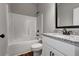 Bathroom with shower-tub combo, granite countertop vanity, and dark fixtures at 304 Old Yorkville Rd, Dallas, GA 30157