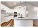 Well-lit kitchen with granite countertops, stainless steel appliances, and an island at 304 Old Yorkville Rd, Dallas, GA 30157