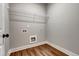 Laundry room with wood floors and wire shelving at 304 Old Yorkville Rd, Dallas, GA 30157