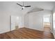 Spacious bedroom with wood floors and natural light, opens to ensuite bathroom at 2413 Charleston Pointe Ct, Atlanta, GA 30316
