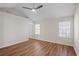 Spacious bedroom with ceiling fan, wood floors and natural light from the two windows at 2413 Charleston Pointe Ct, Atlanta, GA 30316
