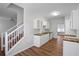 Bright kitchen featuring white cabinets, butcher block countertops, and stainless steel sink at 2413 Charleston Pointe Ct, Atlanta, GA 30316