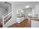 Modern kitchen featuring white cabinets, wooden countertops, and stainless steel sink at 2413 Charleston Pointe Ct, Atlanta, GA 30316