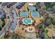 Aerial view of community amenities including pool, tennis courts, playground and clubhouse at 2468 Cannon Farm Ln, Duluth, GA 30097