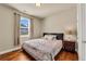 Cozy bedroom with wood floors, natural light, and neutral color scheme at 2468 Cannon Farm Ln, Duluth, GA 30097