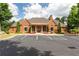 Attractive brick clubhouse with elegant arched windows, landscaping, and ample parking at 2468 Cannon Farm Ln, Duluth, GA 30097