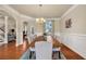 Formal dining room with wood table, upholstered chairs, and natural light at 2468 Cannon Farm Ln, Duluth, GA 30097