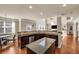 Modern kitchen with granite counters and stainless steel appliances with view to the living room at 2468 Cannon Farm Ln, Duluth, GA 30097