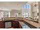 Bright kitchen featuring granite counters and an open view to the living room at 2468 Cannon Farm Ln, Duluth, GA 30097