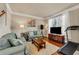 Cozy living room featuring hardwood floors, large windows, and comfortable seating at 2468 Cannon Farm Ln, Duluth, GA 30097