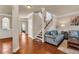 Inviting living room with hardwood floors, neutral walls, and staircase at 2468 Cannon Farm Ln, Duluth, GA 30097