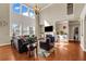 Bright living room boasts soaring ceilings, large windows, and a cozy fireplace at 2468 Cannon Farm Ln, Duluth, GA 30097