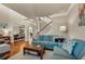 Open living room showcasing hardwood floors, archways, and comfortable furniture at 2468 Cannon Farm Ln, Duluth, GA 30097