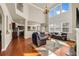 Bright, open-concept living room with hardwood floors and large windows at 2468 Cannon Farm Ln, Duluth, GA 30097