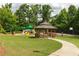 Community playground featuring a covered gazebo, play structures, and a basketball court at 2468 Cannon Farm Ln, Duluth, GA 30097