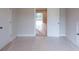 Bedroom with 2 doors leading to other rooms, and carpet flooring at 5360 Memento Trce, Cumming, GA 30040