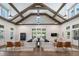 Bright and airy living room with high ceilings, exposed beams, and lots of natural light at 5360 Memento Trce, Cumming, GA 30040