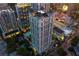 Stunning aerial view of a high-rise building with pool, surrounded by city lights at 199 14Th Ne St # 2407, Atlanta, GA 30309