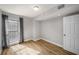 Cozy bedroom featuring a large window, neutral paint, and new flooring at 199 14Th Ne St # 2407, Atlanta, GA 30309
