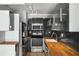 Modern kitchen with stainless steel appliances and stylish black backsplash at 199 14Th Ne St # 2407, Atlanta, GA 30309