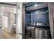 Convenient laundry area with front-loading washer and dryer, plus storage space at 199 14Th Ne St # 2407, Atlanta, GA 30309