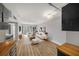 Bright living room featuring hardwood floors, neutral paint, and sliding glass doors to balcony at 199 14Th Ne St # 2407, Atlanta, GA 30309
