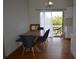Cozy dining room with hardwood floors, modern lighting, and access to an outdoor deck at 2100 Driftwood Cir, Cumming, GA 30041