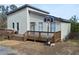 Charming home with a large wooden deck and a basketball hoop, perfect for outdoor fun at 2100 Driftwood Cir, Cumming, GA 30041