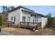 Charming home with a large wooden deck and a basketball hoop, perfect for outdoor fun at 2100 Driftwood Cir, Cumming, GA 30041
