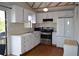 Well-lit kitchen with stainless steel appliances, white cabinets, and hardwood floors at 2100 Driftwood Cir, Cumming, GA 30041