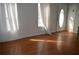 Bright living room with gleaming hardwood floors, freshly painted walls, and updated lighting fixtures at 2100 Driftwood Cir, Cumming, GA 30041
