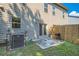 The backyard features a small patio, grass area, and a partial fence at 5036 Longview Walk, Decatur, GA 30035