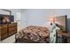 This cozy bedroom has a TV on the dresser and a comfortable-looking bed at 5036 Longview Walk, Decatur, GA 30035