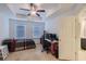 Bright bedroom with tray ceilings, a ceiling fan, and plenty of natural light at 5036 Longview Walk, Decatur, GA 30035